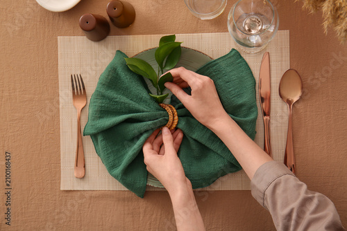 Womans hands arranging a gr...