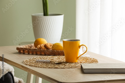 Yellow coffee mug with hot ...