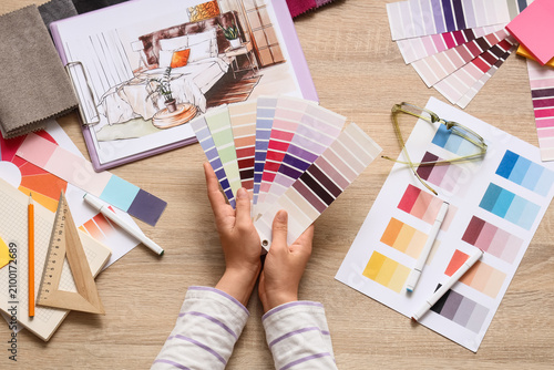 Interior designer holding c...