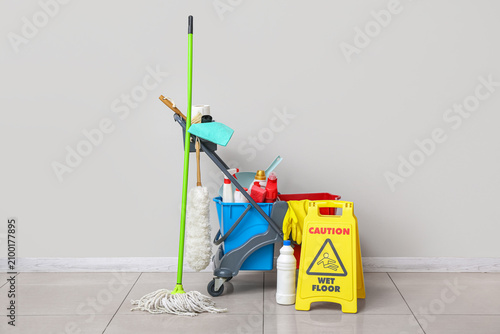 Caution sign with janitors ...