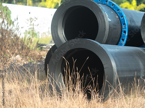 Fotografie High-density polyethylene (HDPE) or steel pipes are used for high-pressure water supply these blue, flanged and bolted pipes are installed both above and below ground
