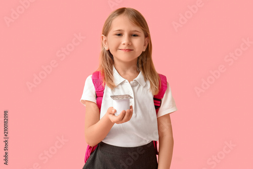 Cute little schoolgirl with...