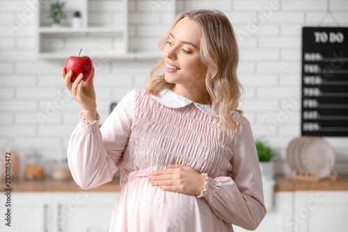Young pregnant woman with a...
