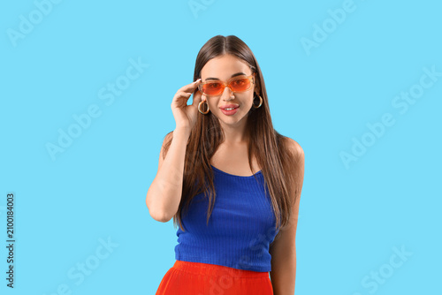 Stylish young woman in sung...