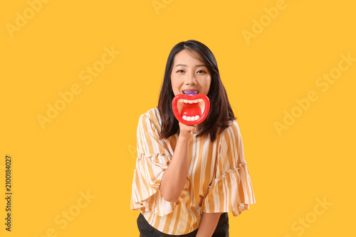 Beautiful Asian woman shout...