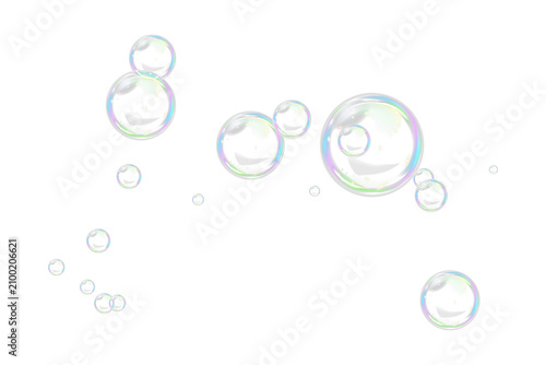 Quadro su tela Floating transparent iridescent soap bubbles with reflections on a white background