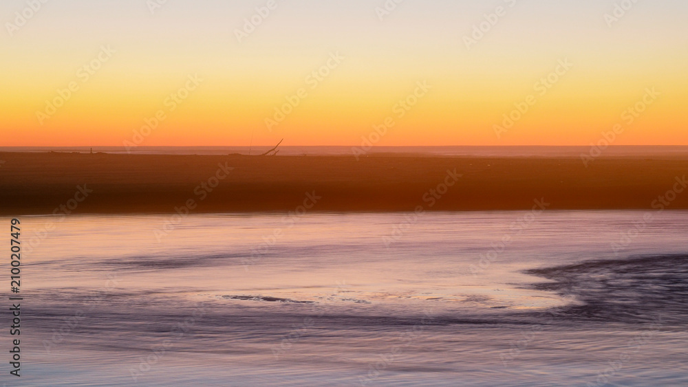 Fototapeta premium Coucher de soleil sur la plage de Moliets