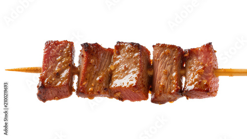 Konstfotografi Isolated delicious savory grilled beef shish kebab cubes on a wooden skewer, per