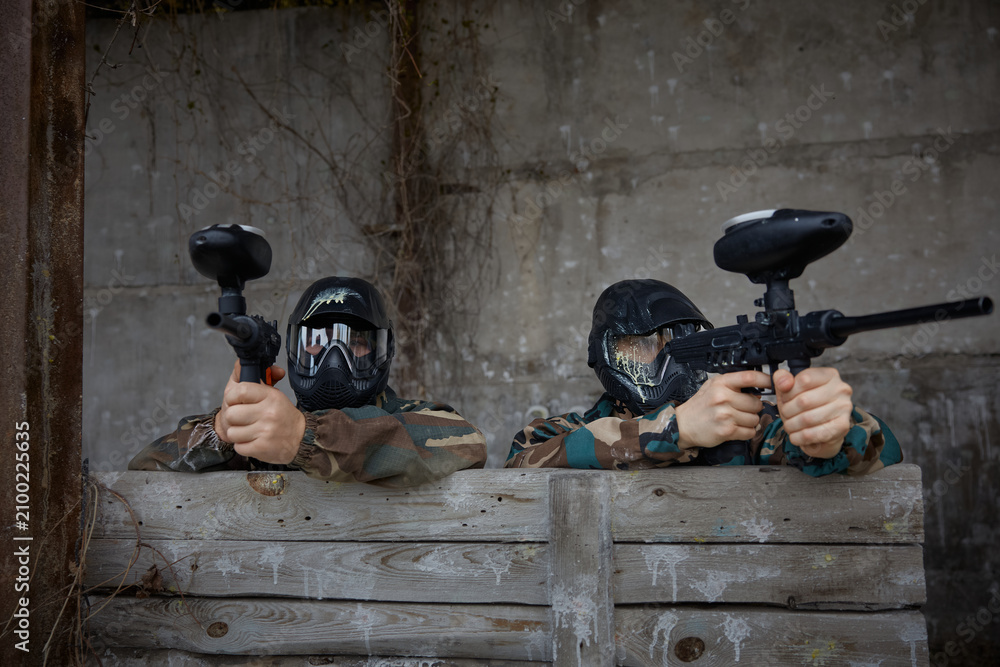 Fototapeta premium Two soldiers take defensive positions during tactical weapon training