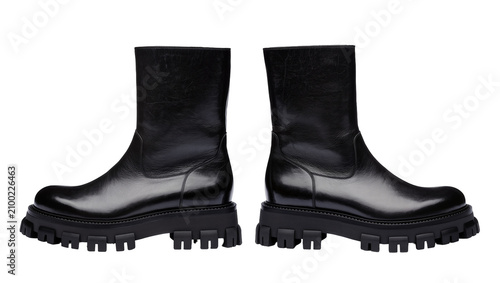Photos Isolated sleek black leather mid-calf boots with chunky lug sole and polished fi