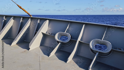 Bild auf Leinwand Horizontal close up of grey painted steel bulwark and mooring chocks on the deck