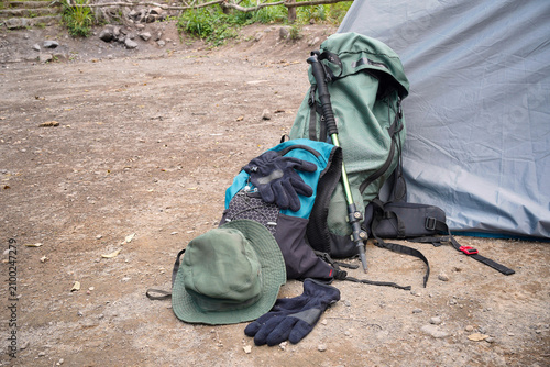 Hiking Backpack and Gear Beside Tent at Campsite