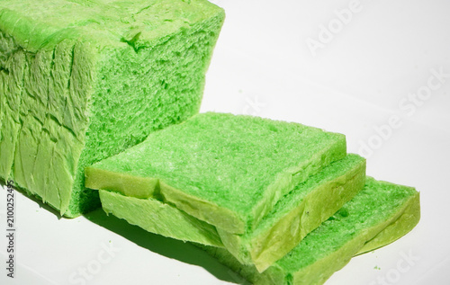 Canvastavla Green pandan bread loaf slice on a white background