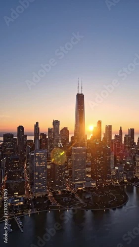 Aerial view of Chicago downtown skyline at sunrise showing buildings and lights