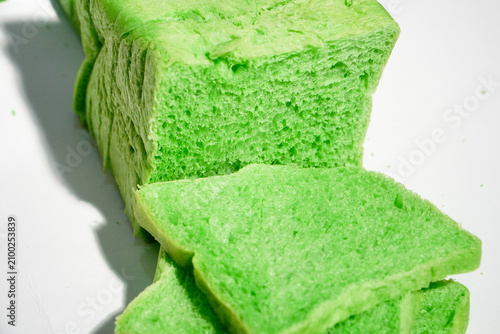 Canvastavla Green pandan bread loaf slice on a white background