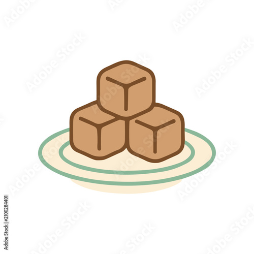 Brown sugar cubes on plate.