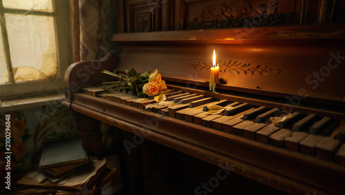 Fotografía Abandoned piano with wilting roses and burning candle, vintage melancholic scene