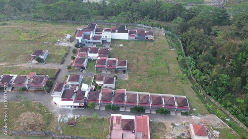 Aerial Drone Footage of Residential Housing Development Surrounded by Green Landscape