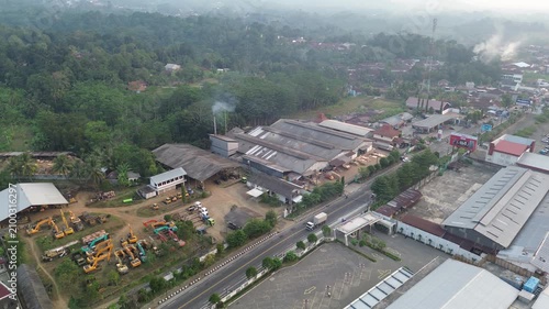 Aerial Drone Footage of Industrial Estate and Warehouse District Along Main Road