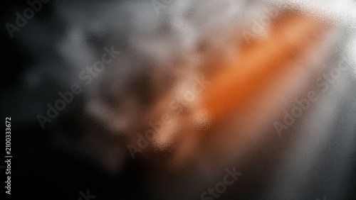 Abstract dark atmospheric background with soft rising smoke, glowing diagonal orange light beam and dramatic volumetric light rays.