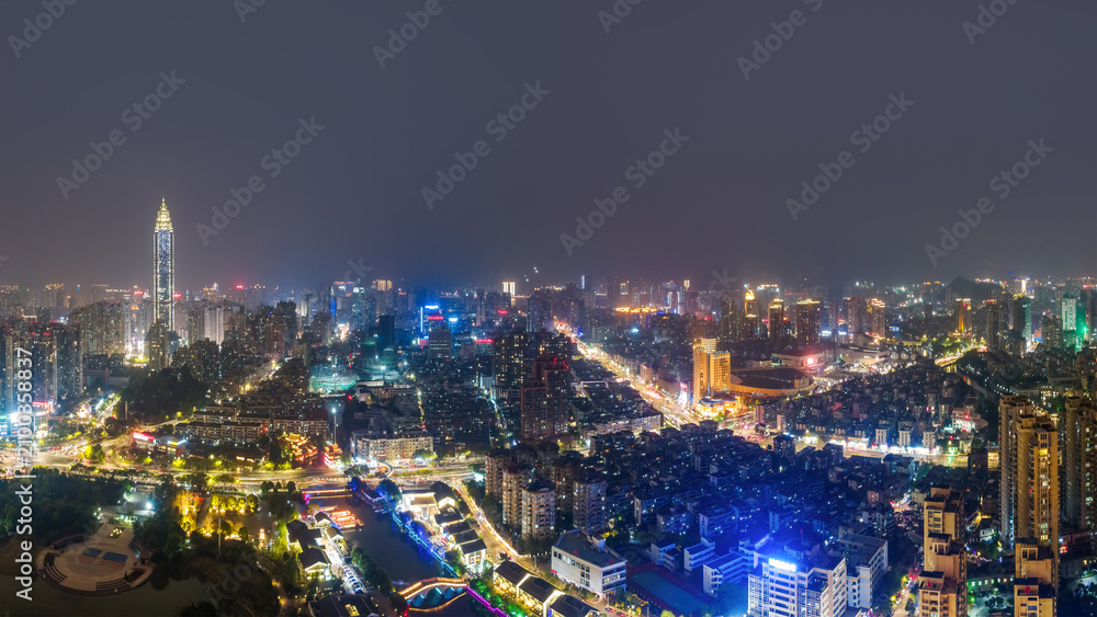 Fototapeta premium Night View of Modern Urban City with Bright Skyscrapers