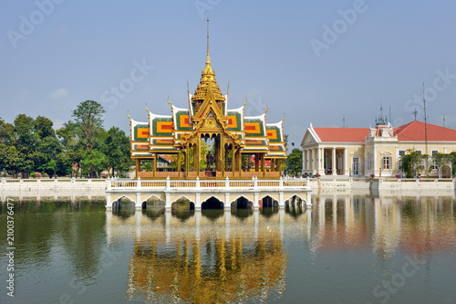Visiting Aisawan Thiphya-at in the Royal Palace at Bang Pa-in with beautiful colors and reflections on the water in Ayutthaya Province