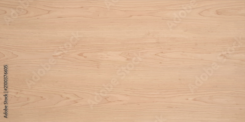 A close-up of light-colored wood grain, showcasing the natural texture and patterns of the material, offering a clean and organic background.