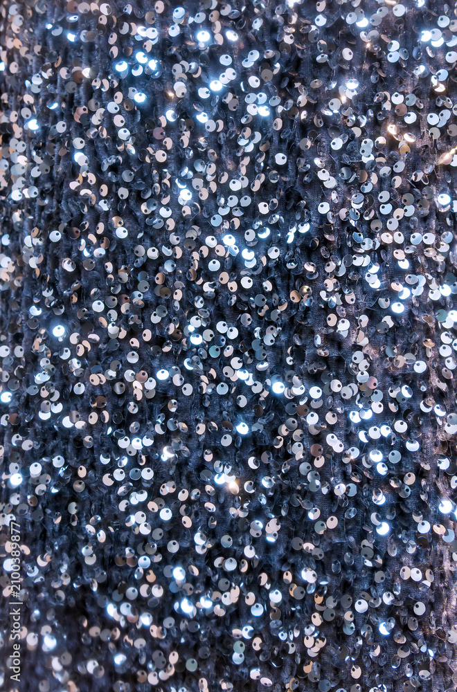 Fototapeta premium Fashionable sparkling shiny silver sequin material texture pattern background