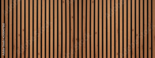 Wood background banner panorama long - Brown wooden acoustic panels wall texture , seamless pattern, vertical