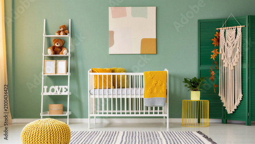 Cuadro en lienzo Bohemian style nursery interior with green wall and toys bohemian interior playr