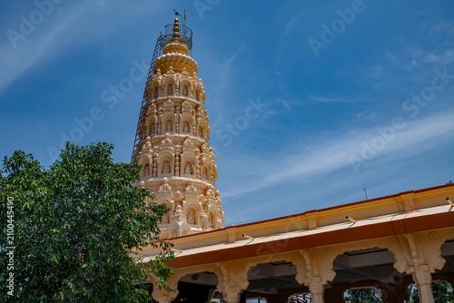 Hindu Temple showcasing the beautifully carved spires (shikhara) of the Malganga Devi, located on the banks of the Kukadi River near the famous natural rock potholes in Nighoj, India.
