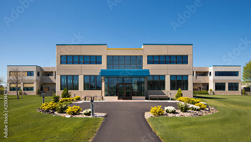 Quadro em tela Low rise corporate office building exterior with landscaped frontage building ex