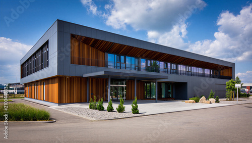 Bild auf Leinwand Modern corporate building featuring sustainable wood paneling and glass low rise