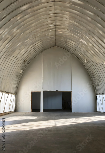 Empty industrial quonset hu...