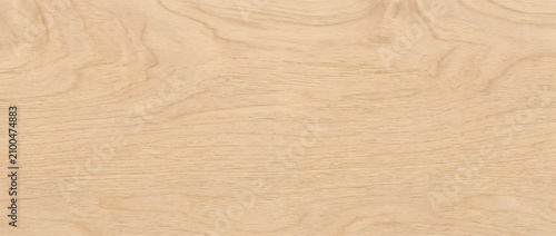Wood texture background showing natural light beige plywood surface with smooth grain patterns for interior design projects