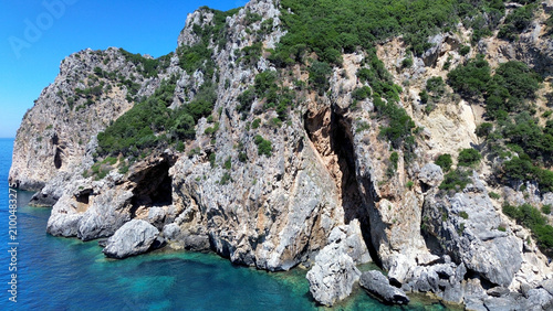 Fotografía Aerial view of the wild Gyali beach in Corfu, Greece, with dramatic high cliffs and crystal clear turquoise sea
