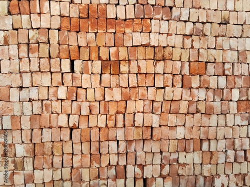 Obraz na plátně Stacked red bricks ready for construction full frame texture
