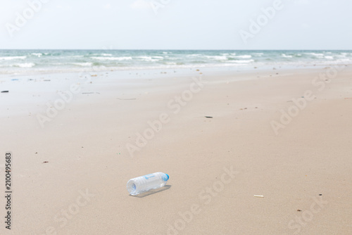 Empty Used Plastic Bottle on Remote Deserted Sea Sand Tropical Beach