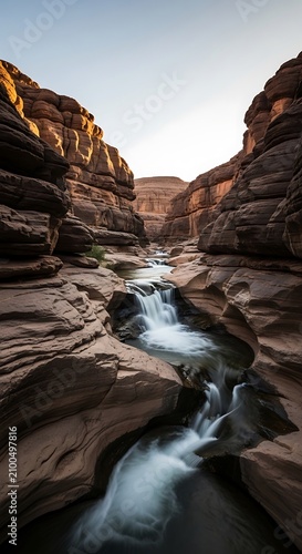 Morning light on rugged canyon river rocks.