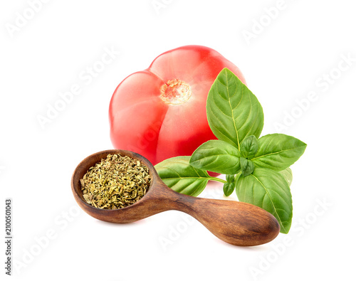 Fresh Basil leaves with tomato in closeup on white  background.   Spice  fresh and dry closeup.