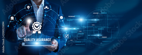 Obraz na plátně Quality Assurance Engineer using tablet analysing Quality Assurance data