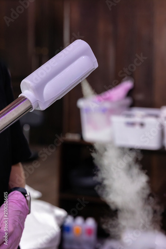 Konstfotografi Close-up of a facial steamer releasing warm steam to soften skin and open pores before professional facial cleansing and extraction in a modern beauty clinic