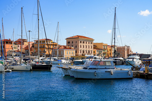 Yachts and sailboats in the port of Cala Gavetta in La Maddalena, capital city of the eponym archipelago located in the Mediterranean Sea in north-east of Sardinia, Italy