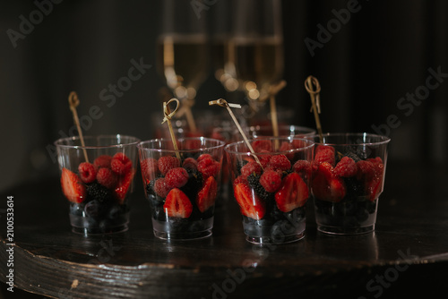 close up of a glass of red wine with a spoon