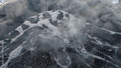 Close-up of Ice and Water Bubbles on Frozen Surface.