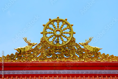 Dharma wheel and deer statues at truc lam chanh giac zen monastery in cai lay vietnam
