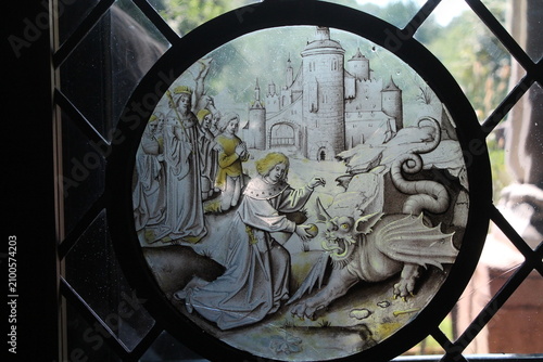 Canvas Print Roundel stained glass with Daniel slaying the dragon