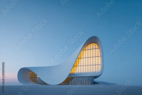 A white building with a curved roof in the middle of a desert illuminated by the warm light of the setting sun. the sky is a deep blue and the building is surrounded by a vast expanse of sand.