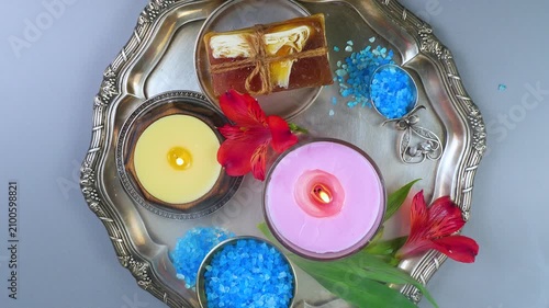 A composition of spa accessories slowly rotates around its axis. View from above.