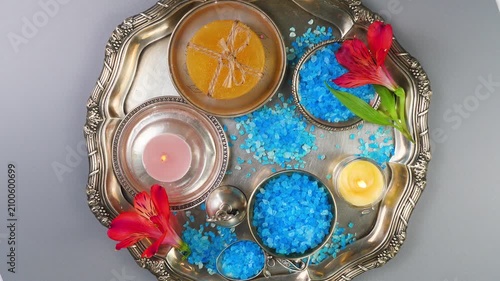 A composition of spa accessories slowly rotates around its axis. View from above.